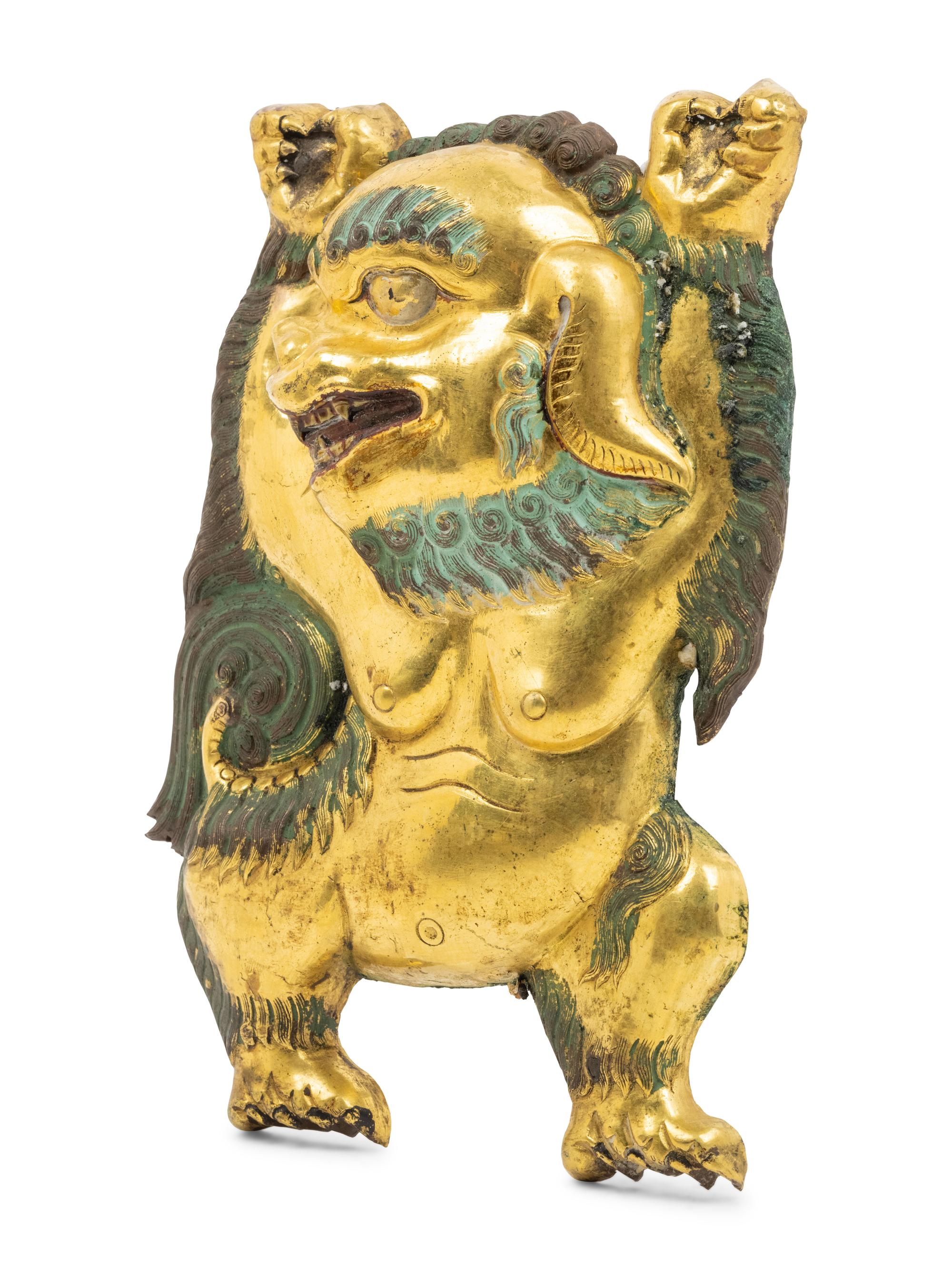A Sino-Tibetan Gilt Bronze Repoussé Fu-Lion