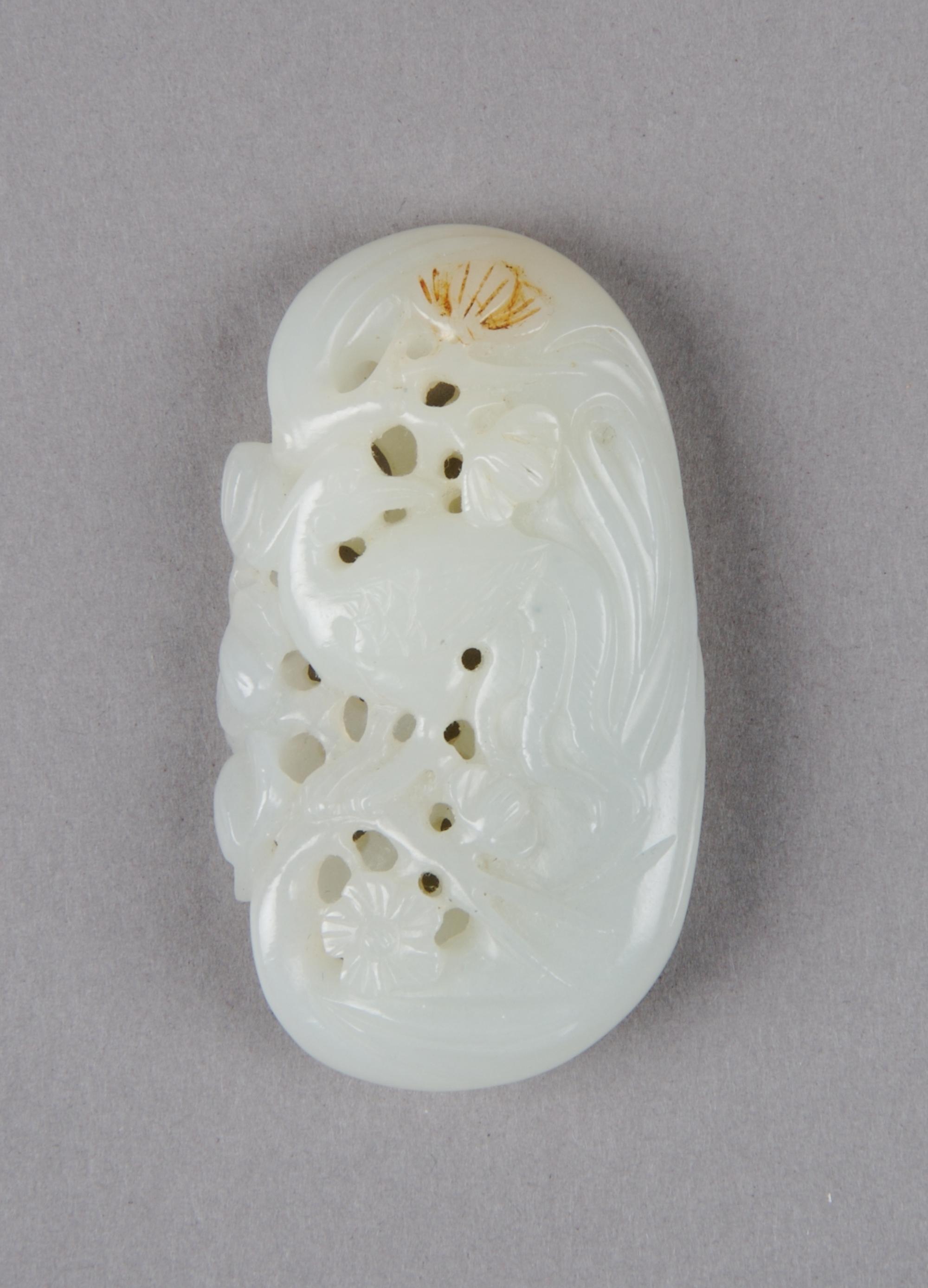 A Chinese Celadon Jade Pendant, Height 2 1/4 inches.