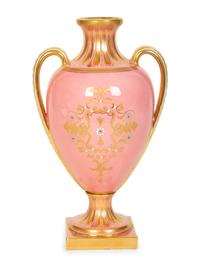 A Coalport Porcelain Pink-Glazed Urn