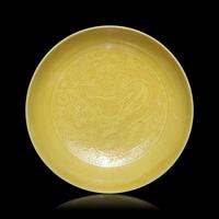 A Pair of Chinese Yellow Glazed Incised Porcelain 'Dragon' Dishes, Qianlong Marks and of the Period 清乾隆 嬌黃釉龍紋碟一對