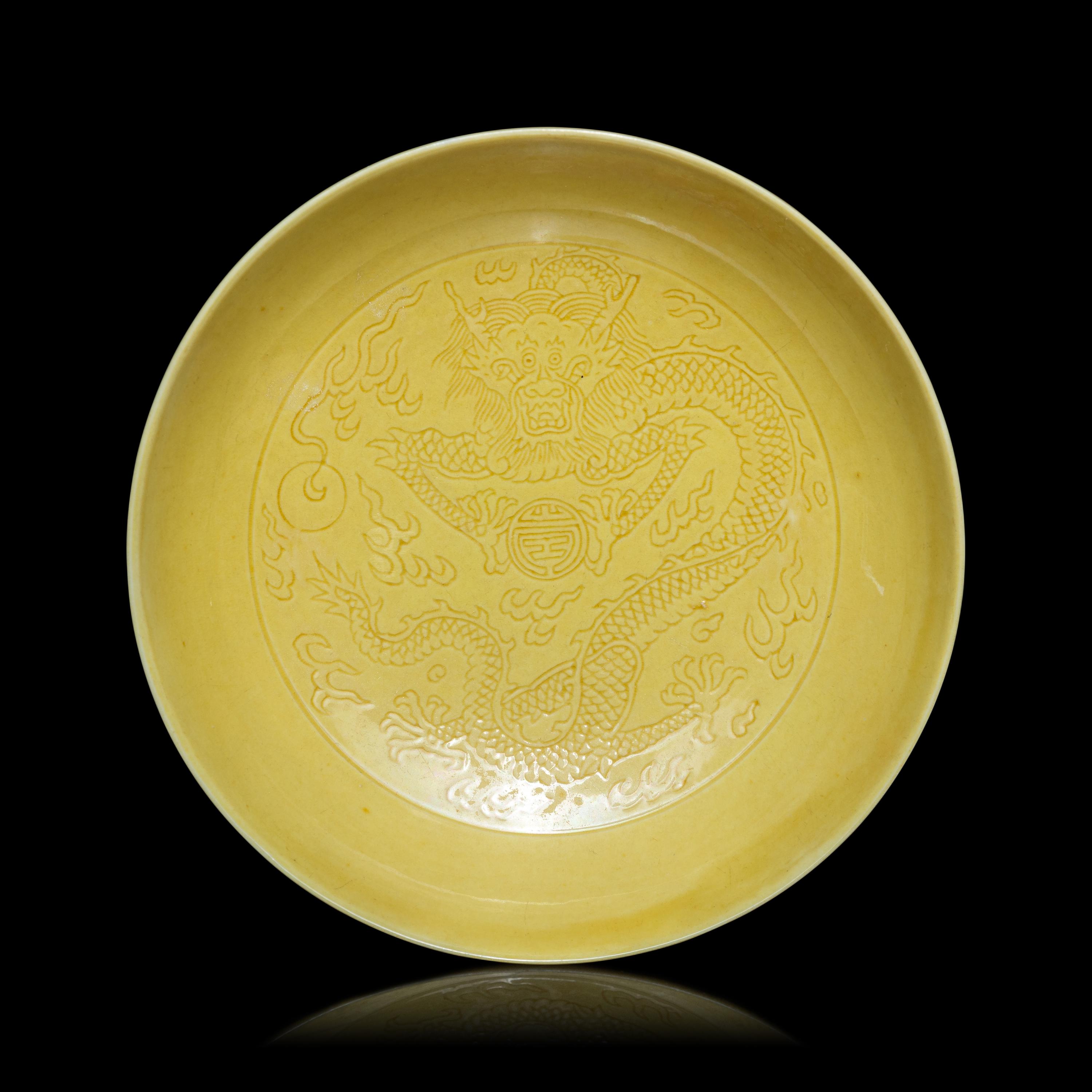 A Pair of Chinese Yellow Glazed Incised Porcelain 'Dragon' Dishes, Qianlong Marks and of the Period 清乾隆 嬌黃釉龍紋碟一對