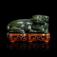 A Chinese Spinach Jade Buffalo, Qing Dynasty 清 青玉臥牛