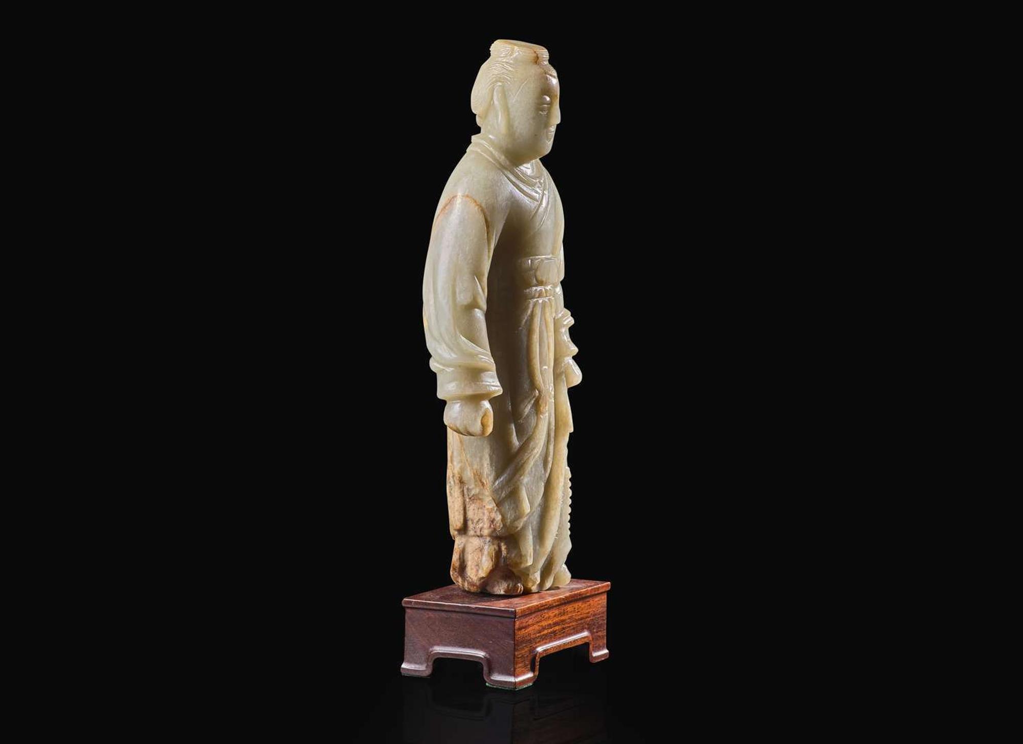 An unusual Chinese carved celadon jade figure of a man in long robes, possibly 18th century or earlier 玉雕人物 可能為十八世紀或更早