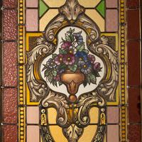 A French Carved Walnut and Leaded Glass Double-Door Portal