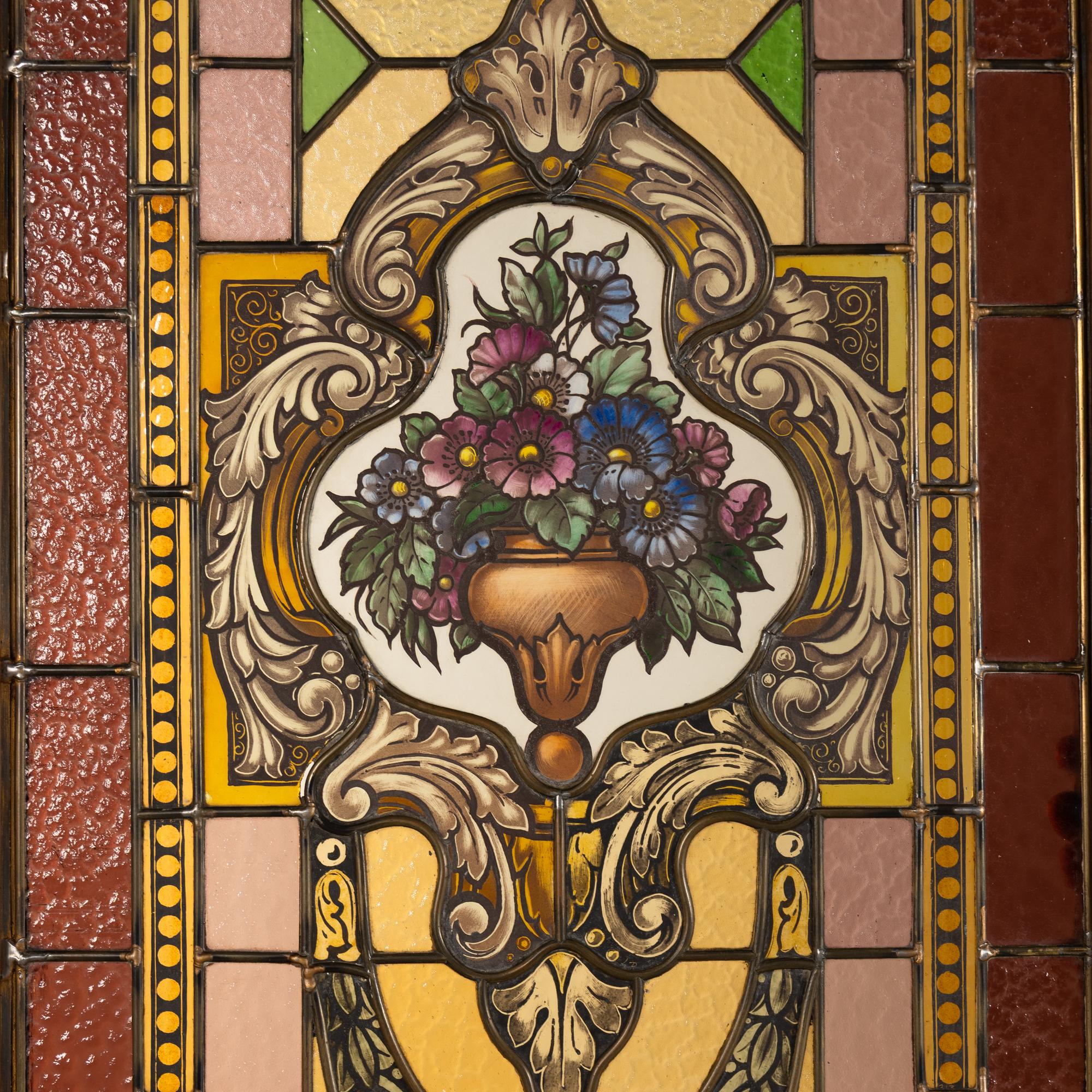 A French Carved Walnut and Leaded Glass Double-Door Portal