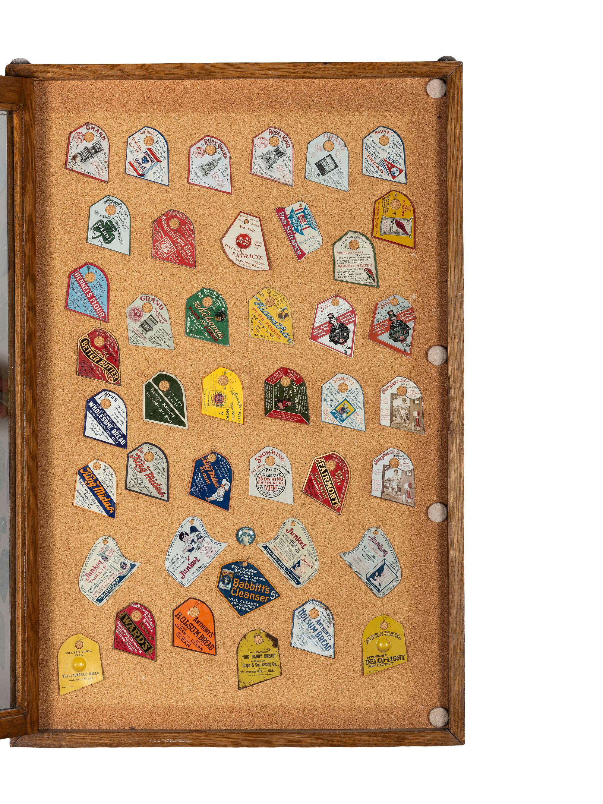 A Collection of Tin Lithograph Advertising Pot Scrapers