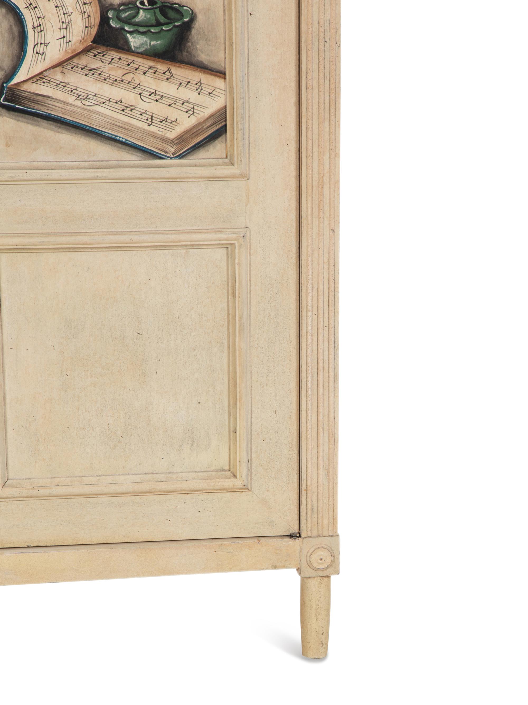 An Italian Painted Armoire with Book Decoration to the Doors