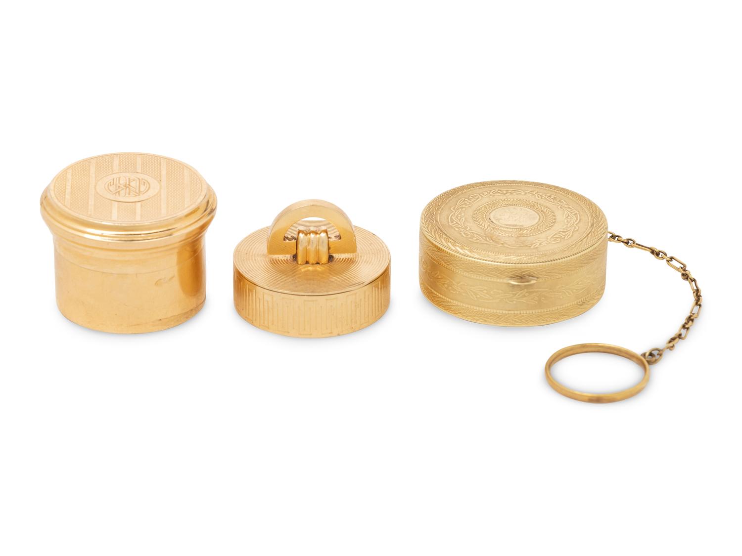 Two Cartier Gold Pill Boxes and Another Gold Pill Box
