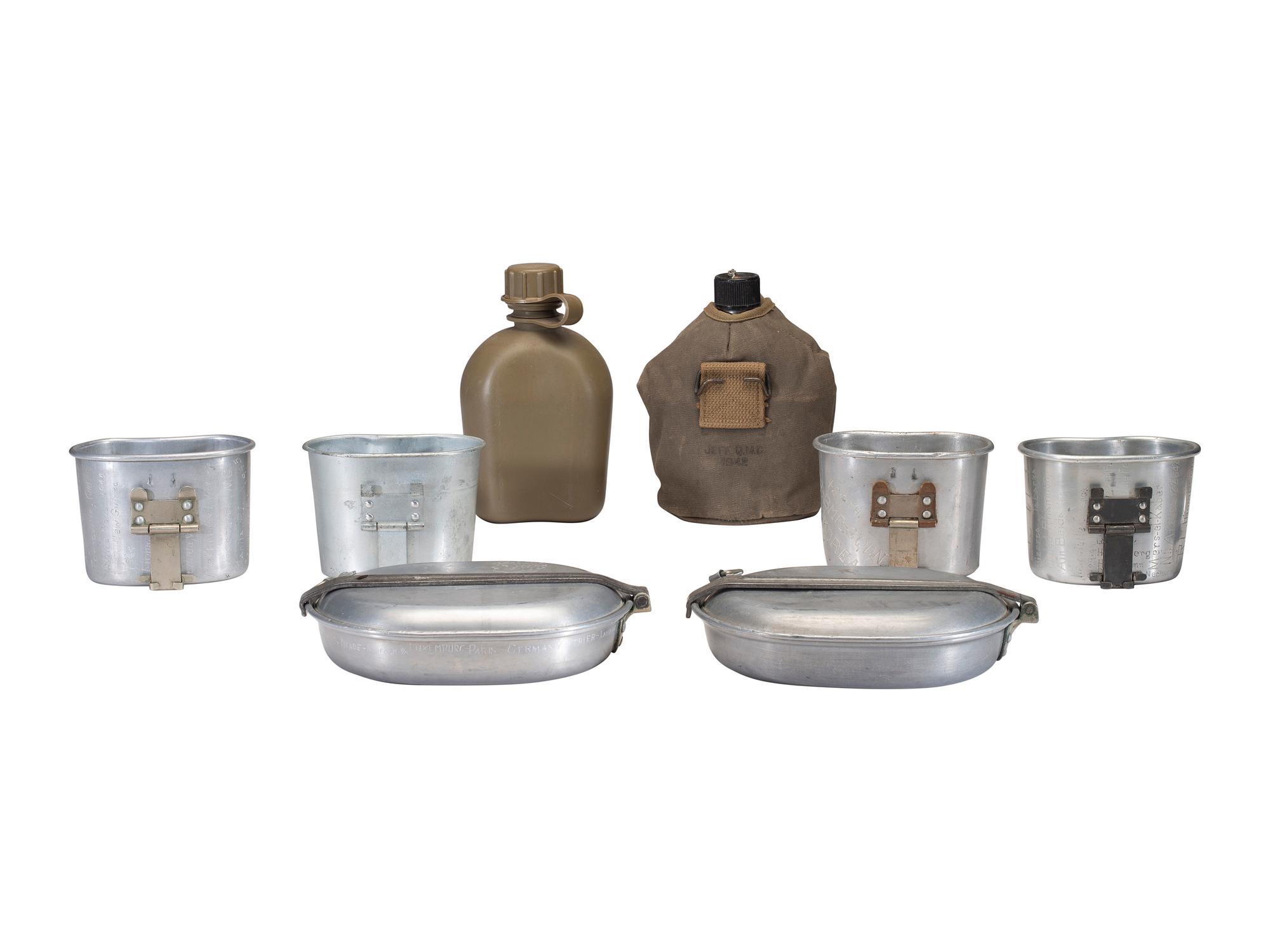 [MILITARIA]. World War II and Korean War-era canteens, canteen covers, and mess kits.