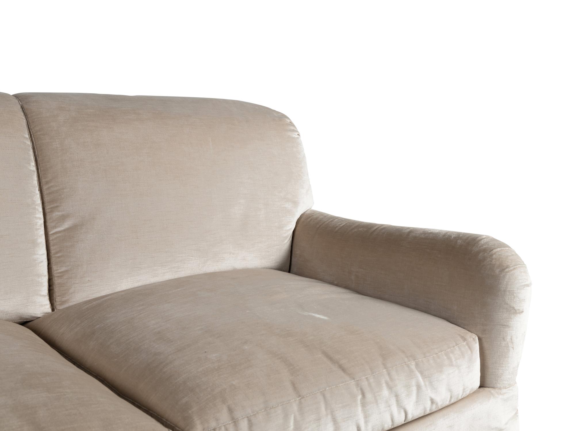 A Velvet-Upholstered Three-Cushion Sofa