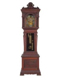 A Renaissance Revival Carved Walnut Tall Case Clock