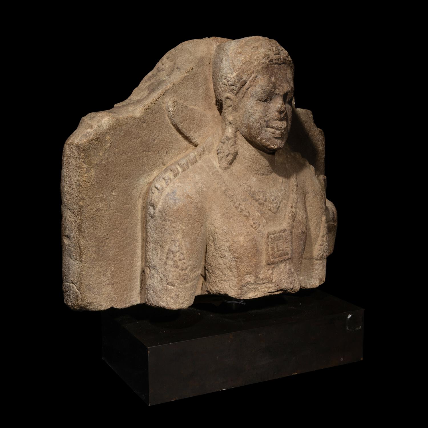 An Indonesian Volcanic Stone Bust of Kumara, Java, 9th/10th Century