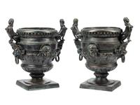 A Pair of Egyptian Revival Patinated Metal Planters