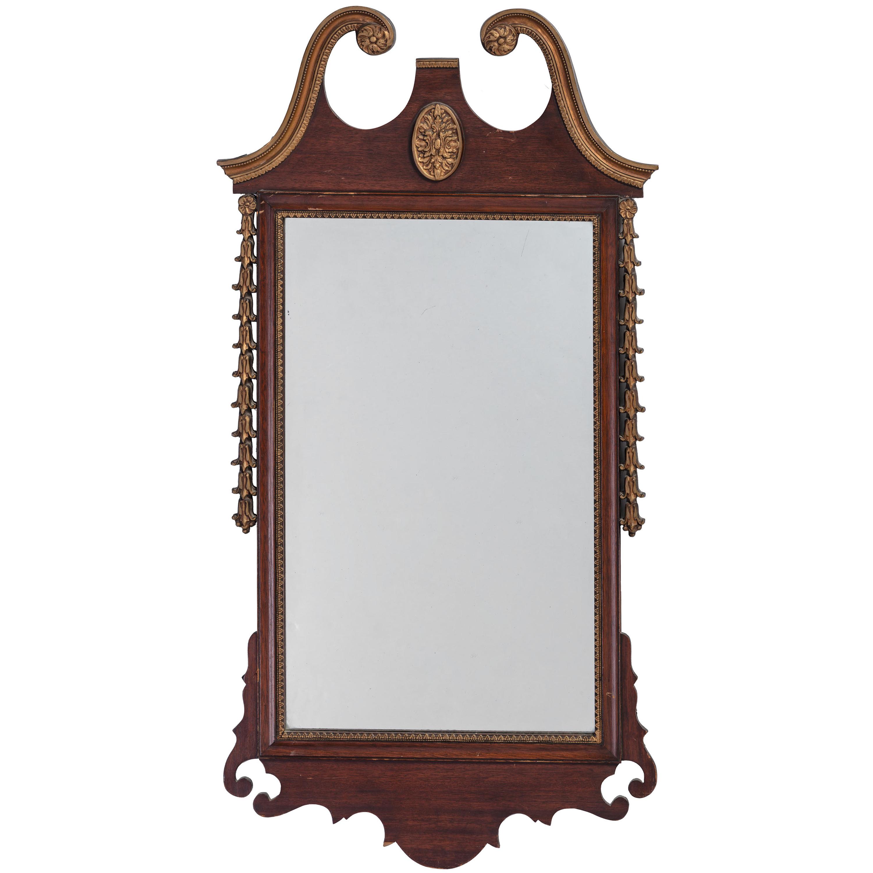A George III Style Carved and Parcel Gilt Mahogany Mirror