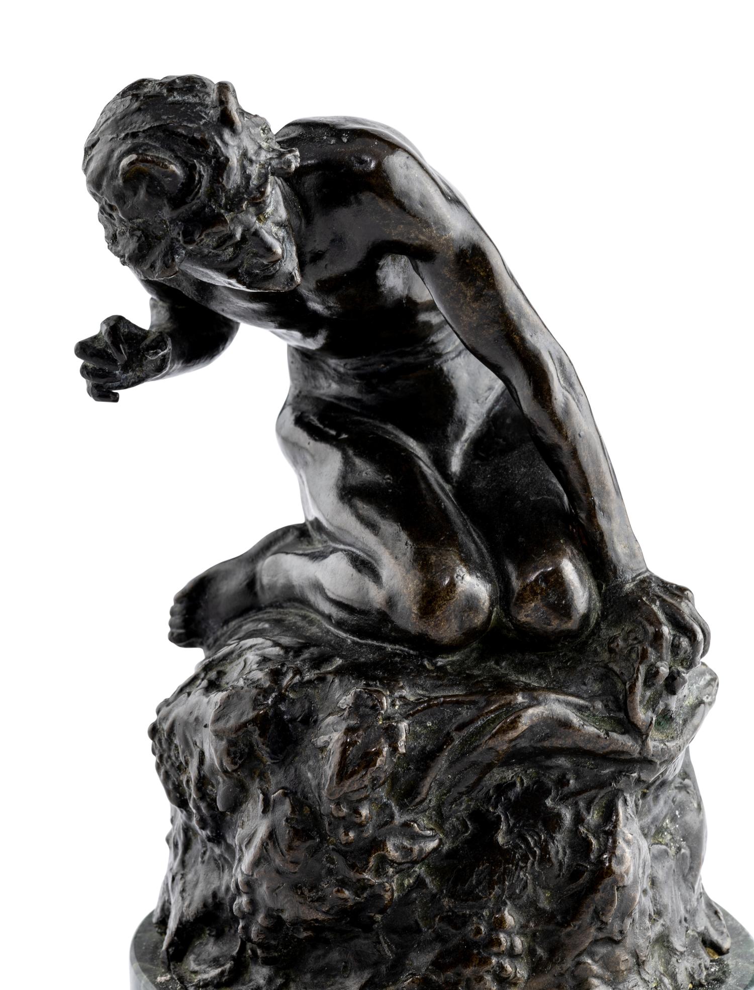 A Bronze Figure of Satyr on the Rocks