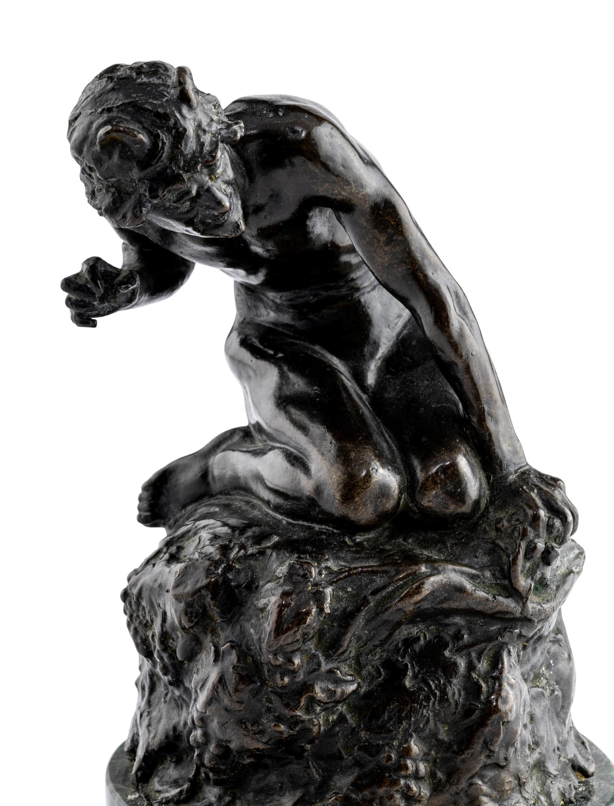 A Bronze Figure of Satyr on the Rocks