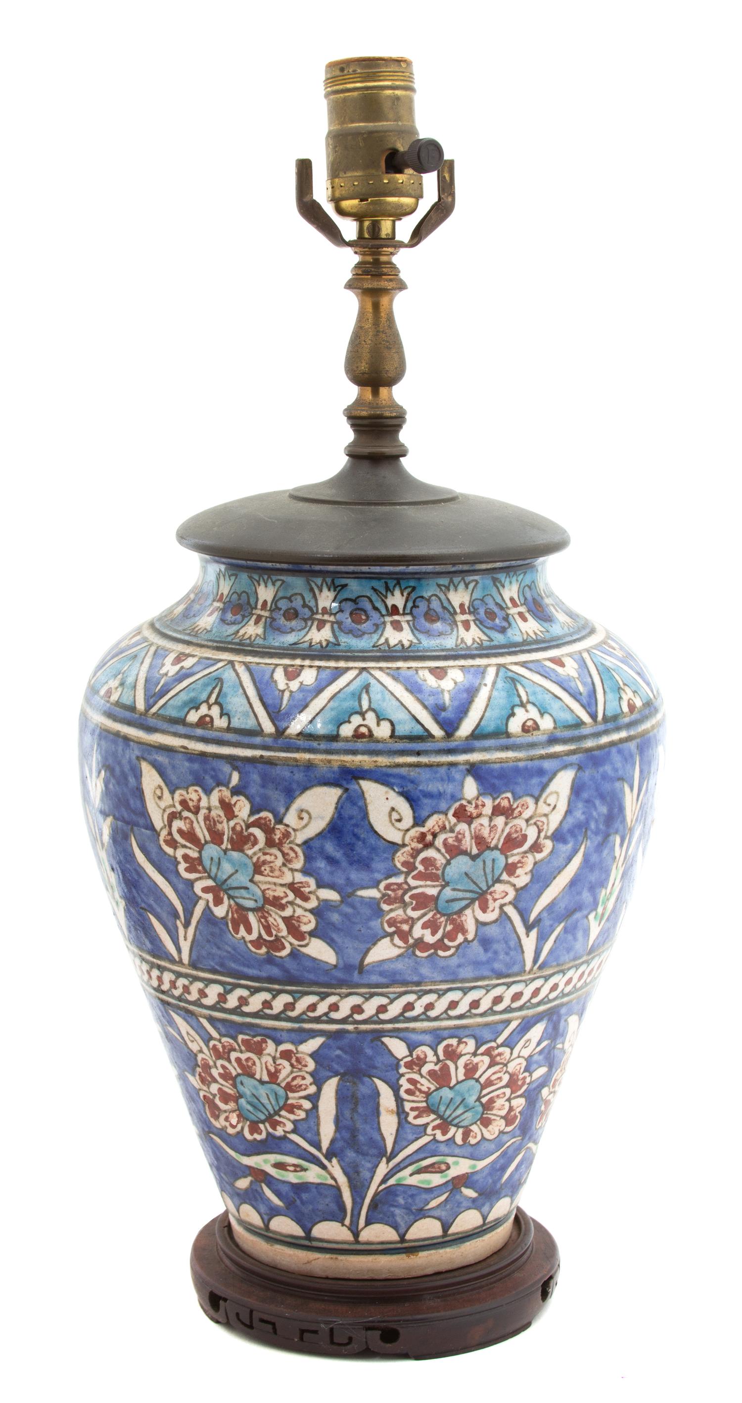 A Persian Glazed Ceramic Vase Vase, height 11 inches.