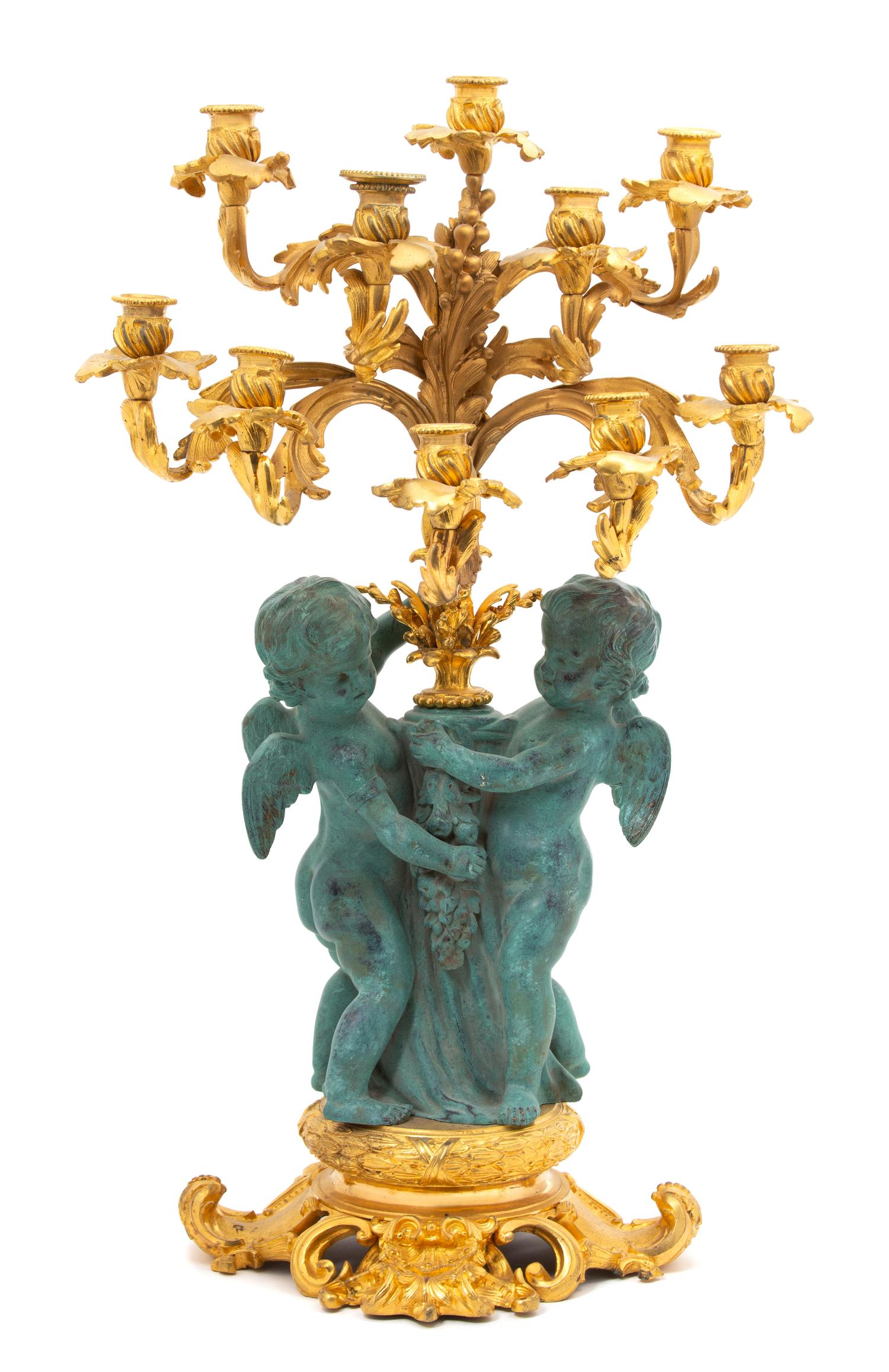 A Louis XV Style Parcel Gilt & Patinated Bronze Ten-Light Candelabrum Height 28 inches. — 20TH CENTURY