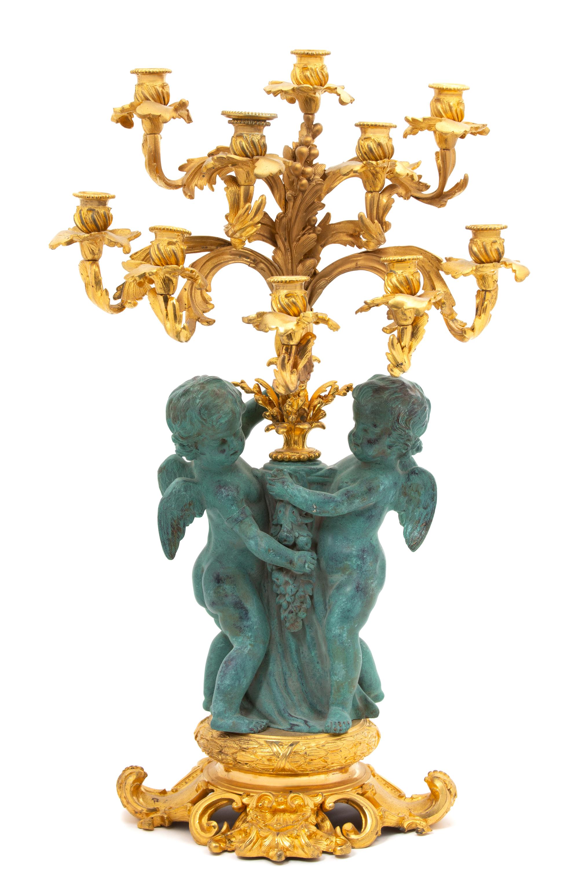 A Louis XV Style Parcel Gilt & Patinated Bronze Ten-Light Candelabrum Height 28 inches. — 20TH CENTURY