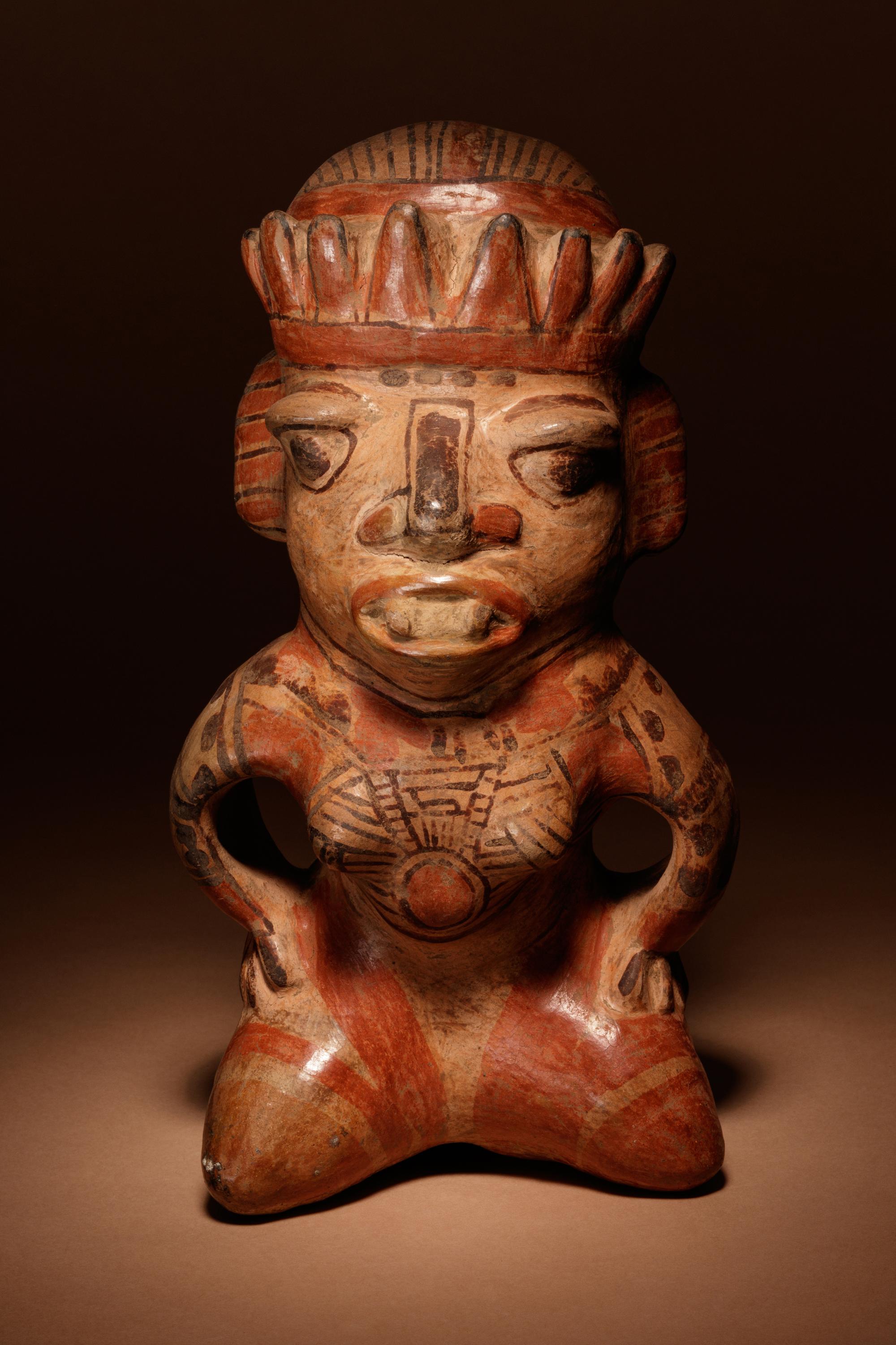 A Nicoya Polychrome Terracotta Seated Figure