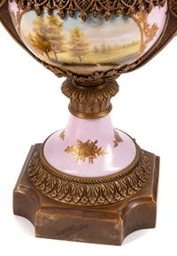 A Pair of Sèvres Style Gilt Bronze Mounted Porcelain Urns