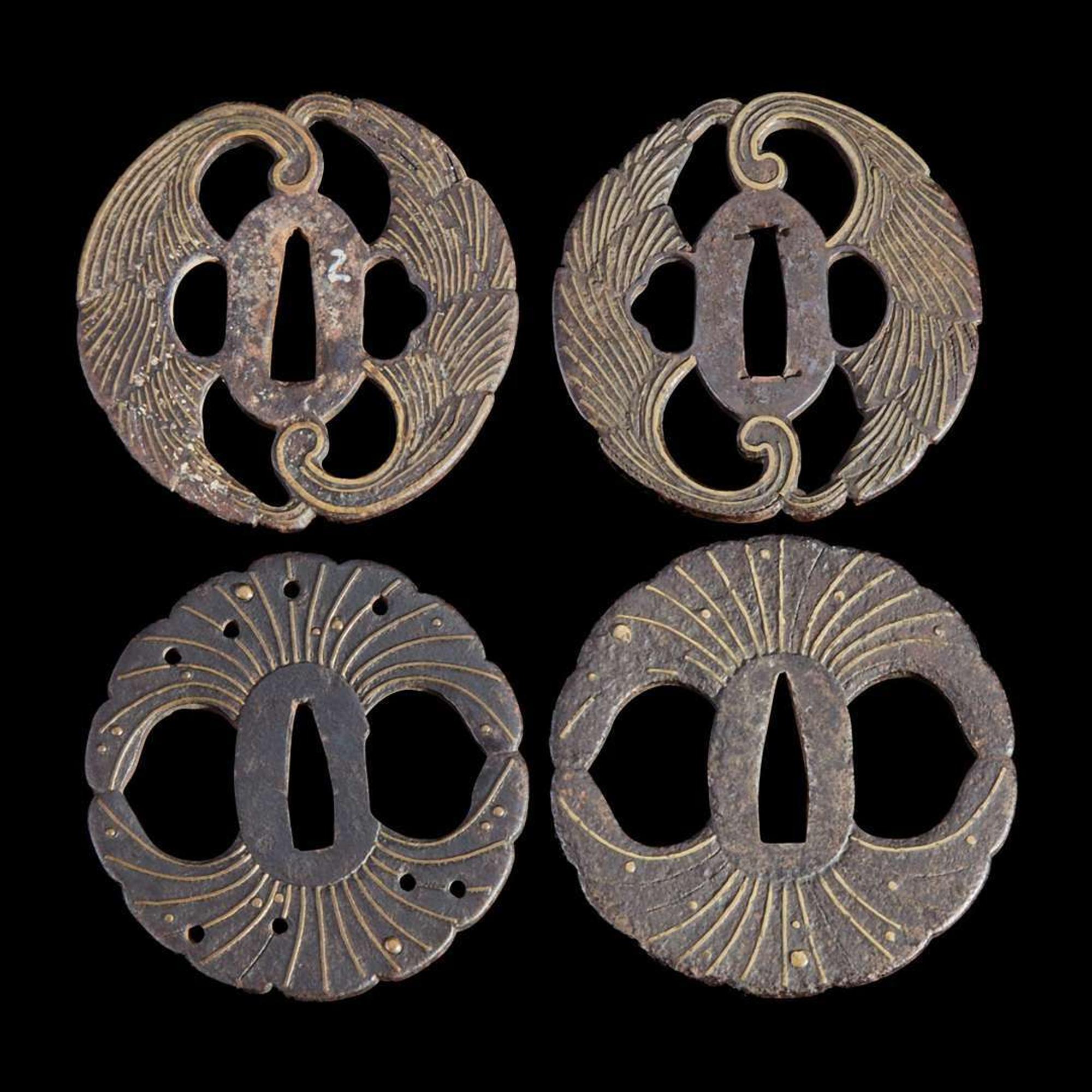 Group of eight assorted Japanese tsuba Meiji period and earlier