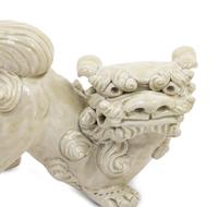 A Pair of Chinese White Glazed Porcelain Figures of Fu Lions