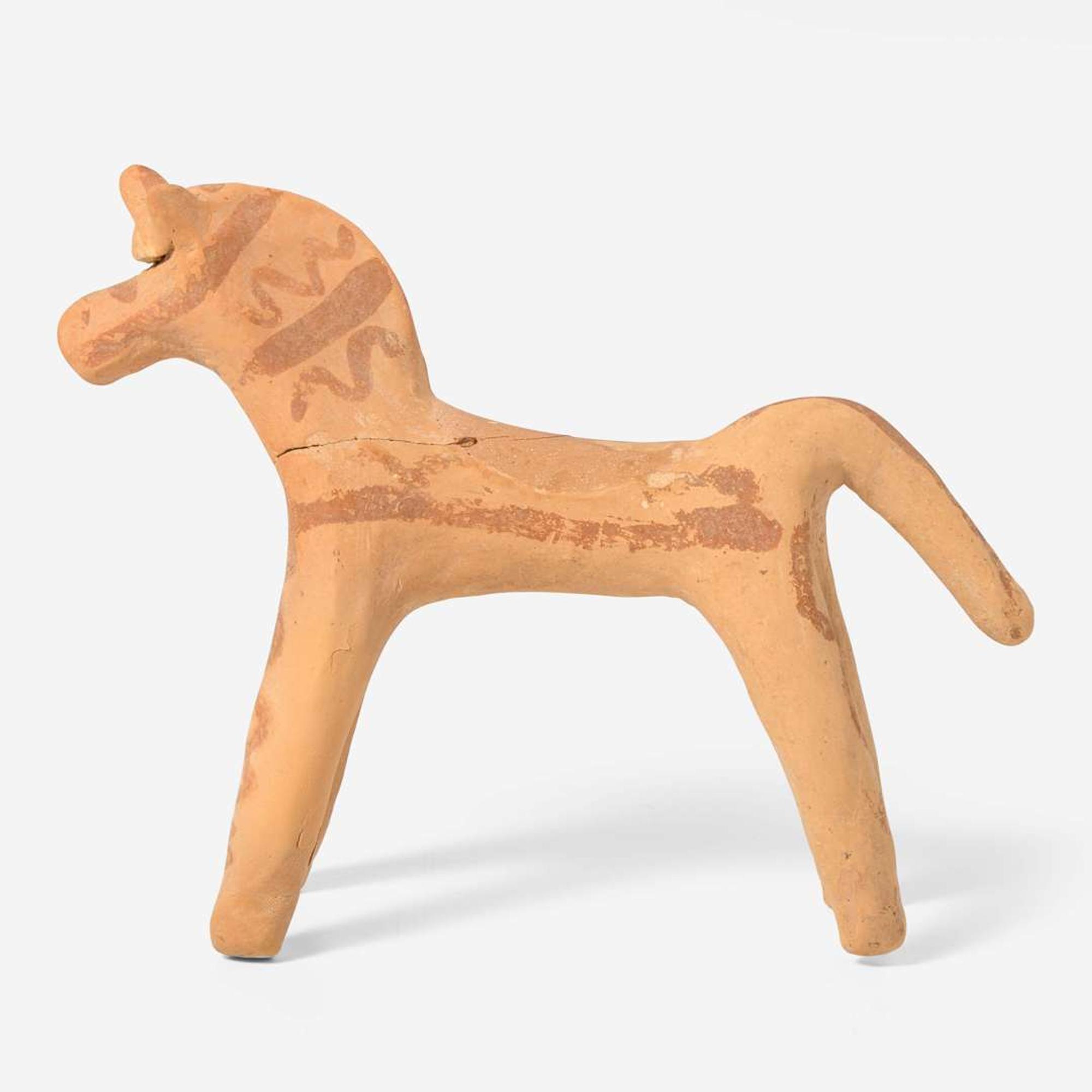 A Boeotian terracotta figure of a horse circa 6th century B.C.