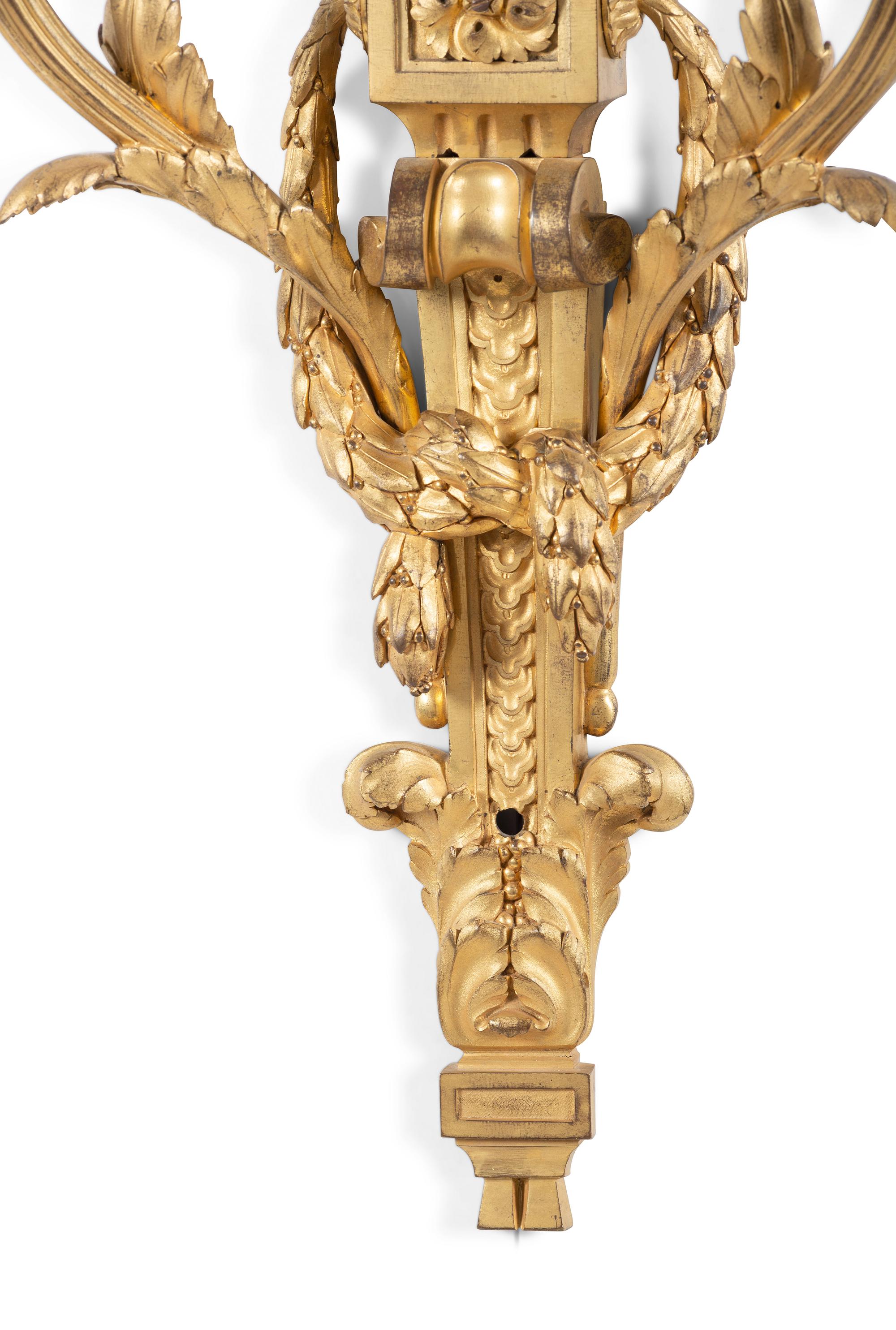 A Pair of Louis XVI Gilt Bronze Two Light Wall Sconces