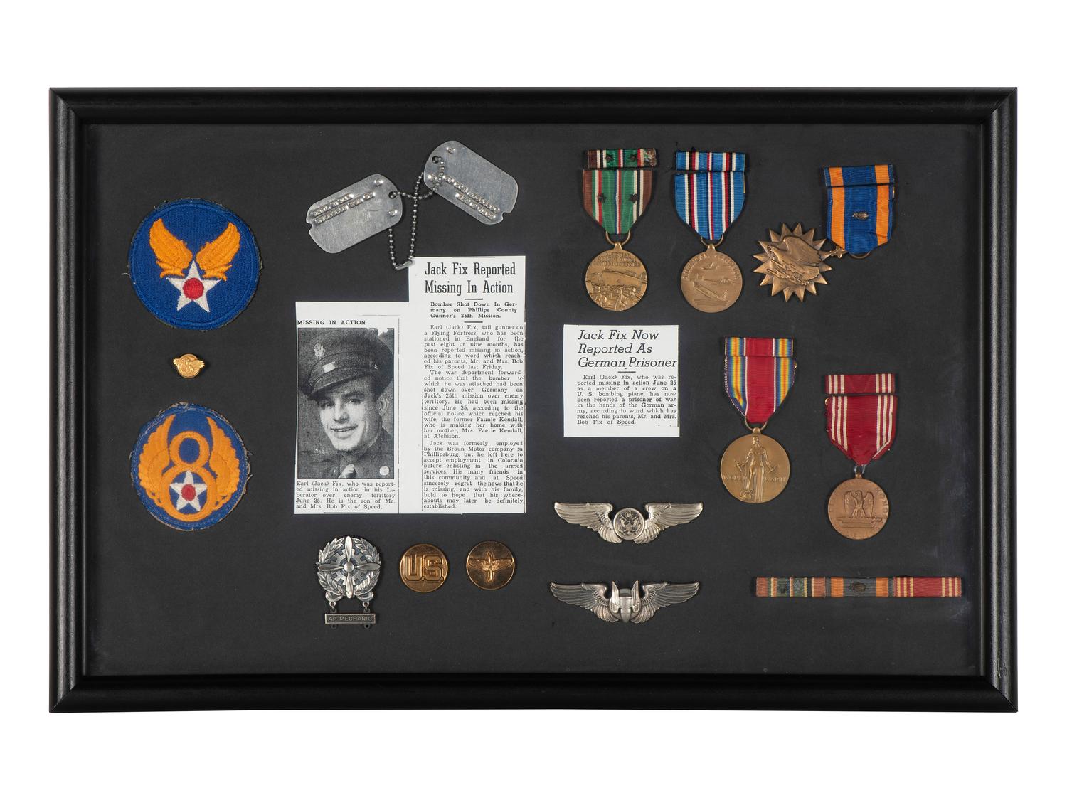 [WORLD WAR II]. Two framed displays featuring medals and patches of identified soldiers.