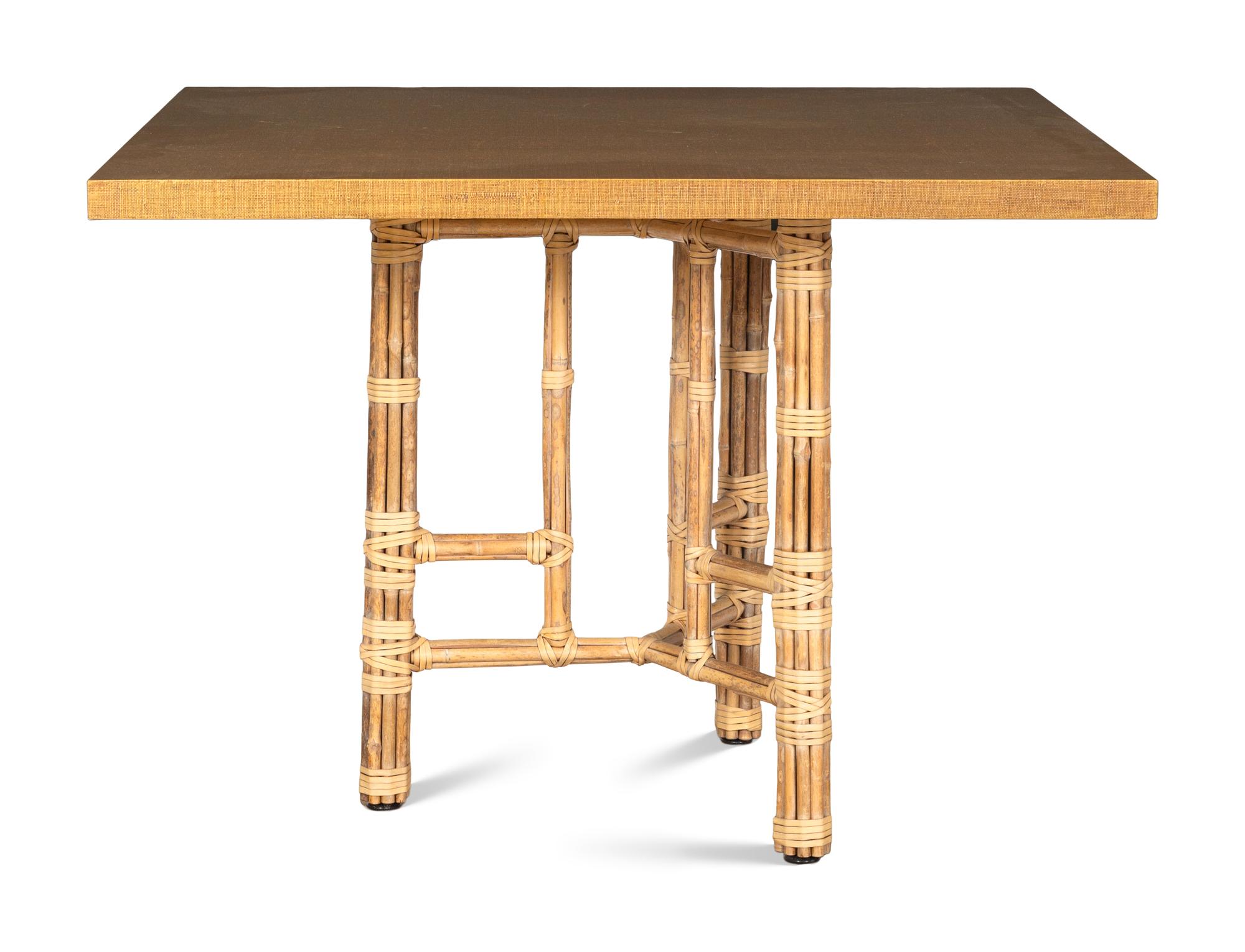 A Set of Four McGuire Rattan Target Armchairs and an Organic Bamboo Table