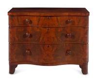 A Continental Walnut Serpentine-Front Chest of Drawers