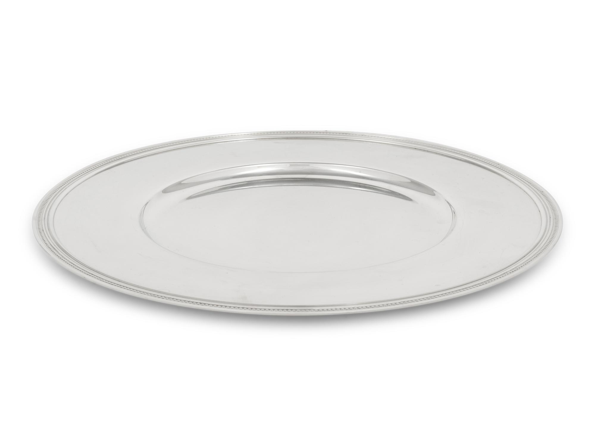 A Set of Ten Christofle Silver-Plate Chargers
