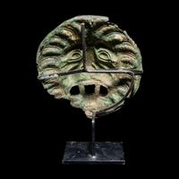 A Roman Bronze Sarcophagus Mask in the form of a Lion