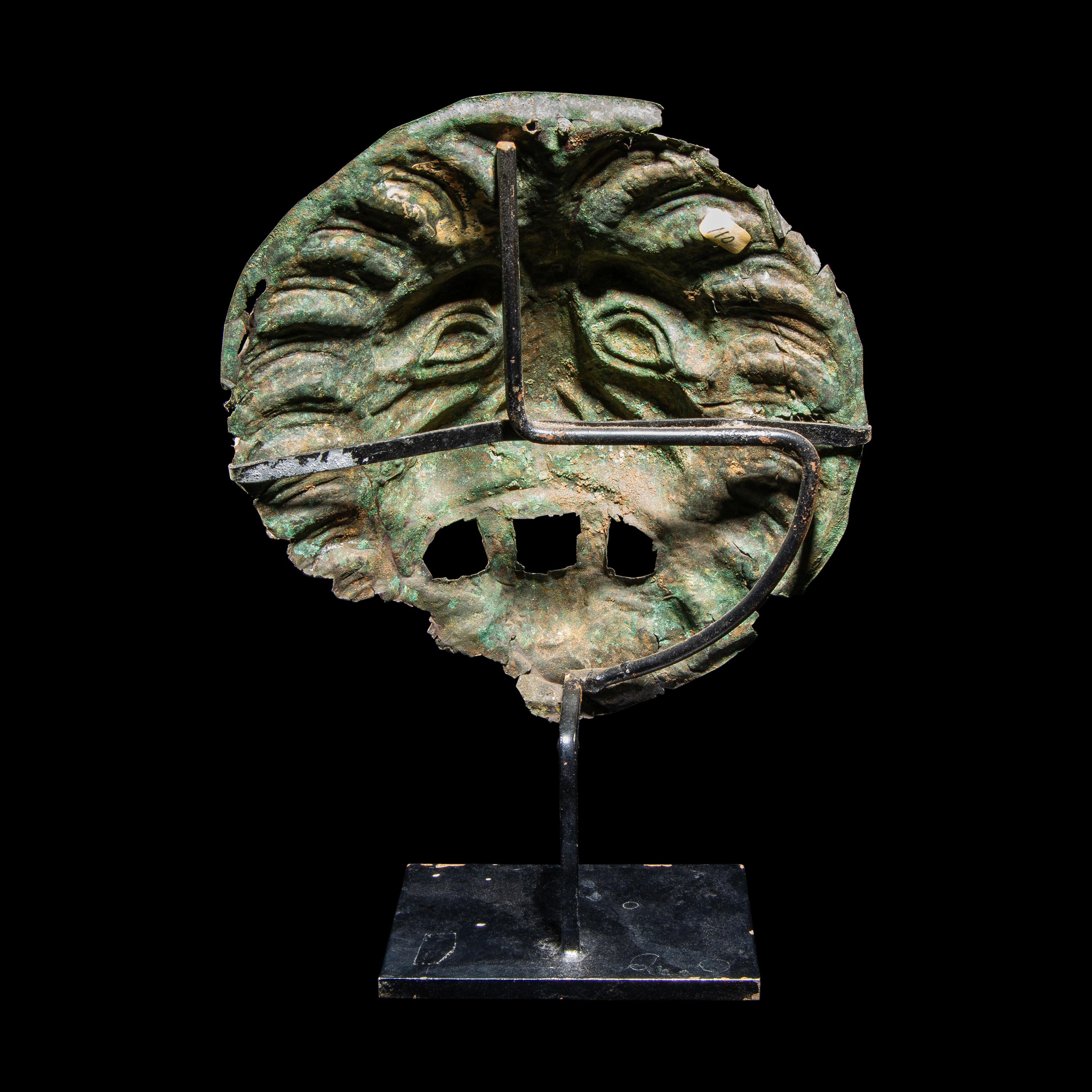 A Roman Bronze Sarcophagus Mask in the form of a Lion