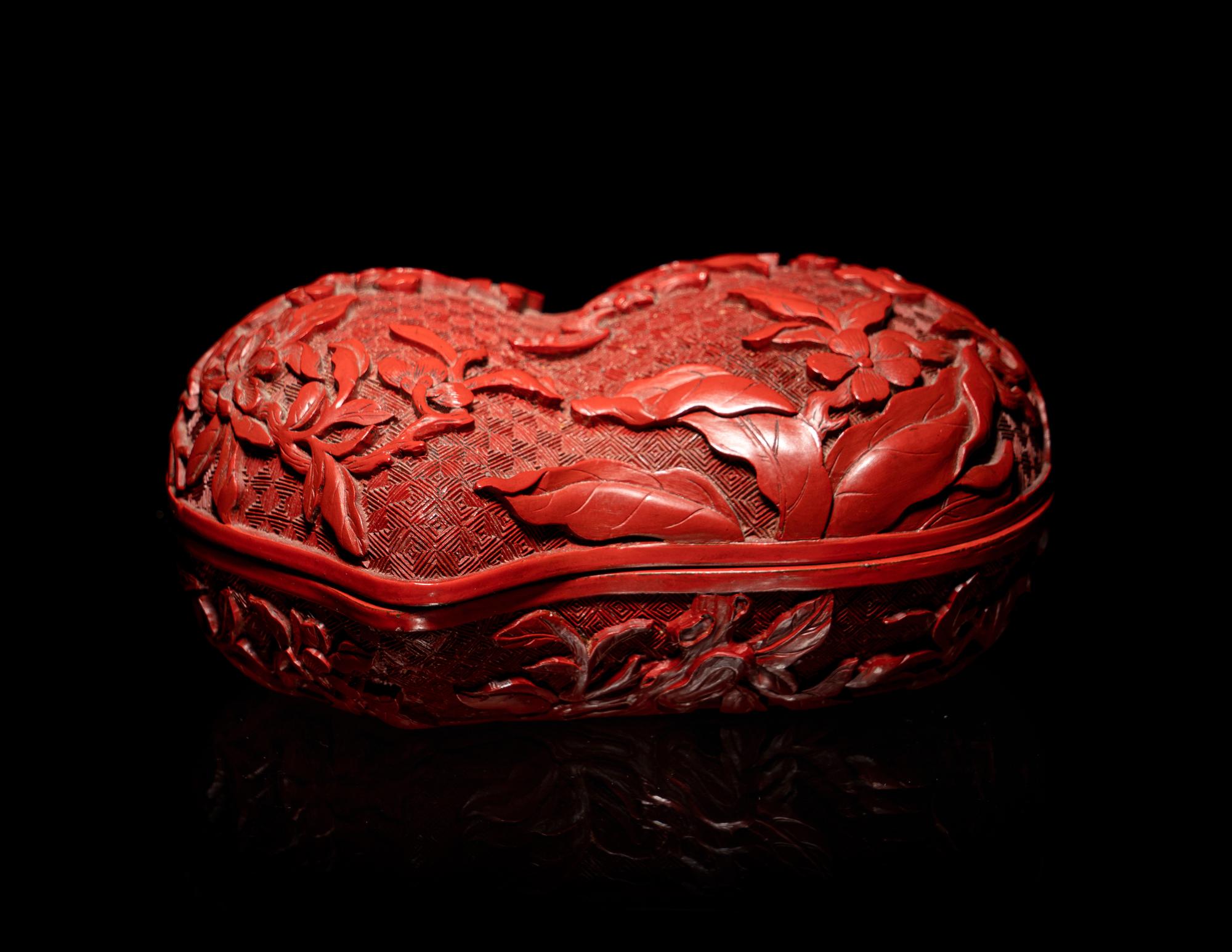 A Chinese Cinnabar Lacquer Double-Peach Form Box and Cover