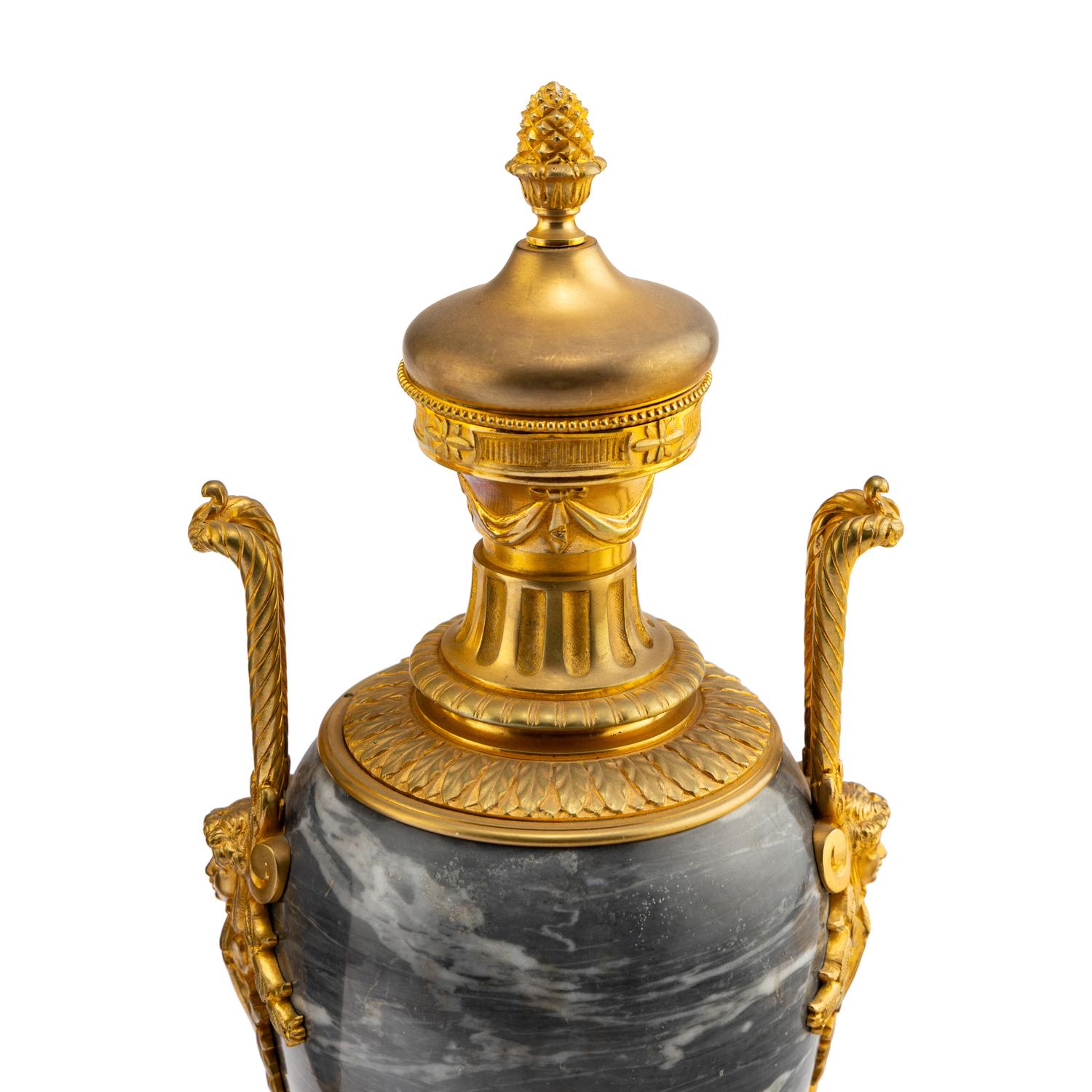 A Pair of Louis XVI Style Gilt Bronze Mounted Marble Urns