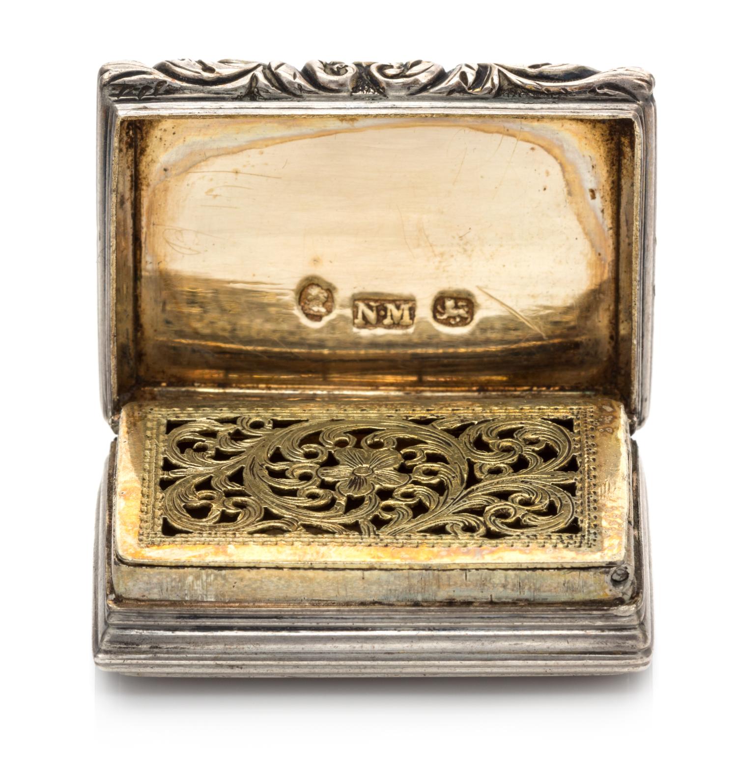 A George IV Silver Vinaigrette, Nathaniel Mills, Birmingham, 1830, having a ribbed case, the lid centered by a monogrammed cartouche, t