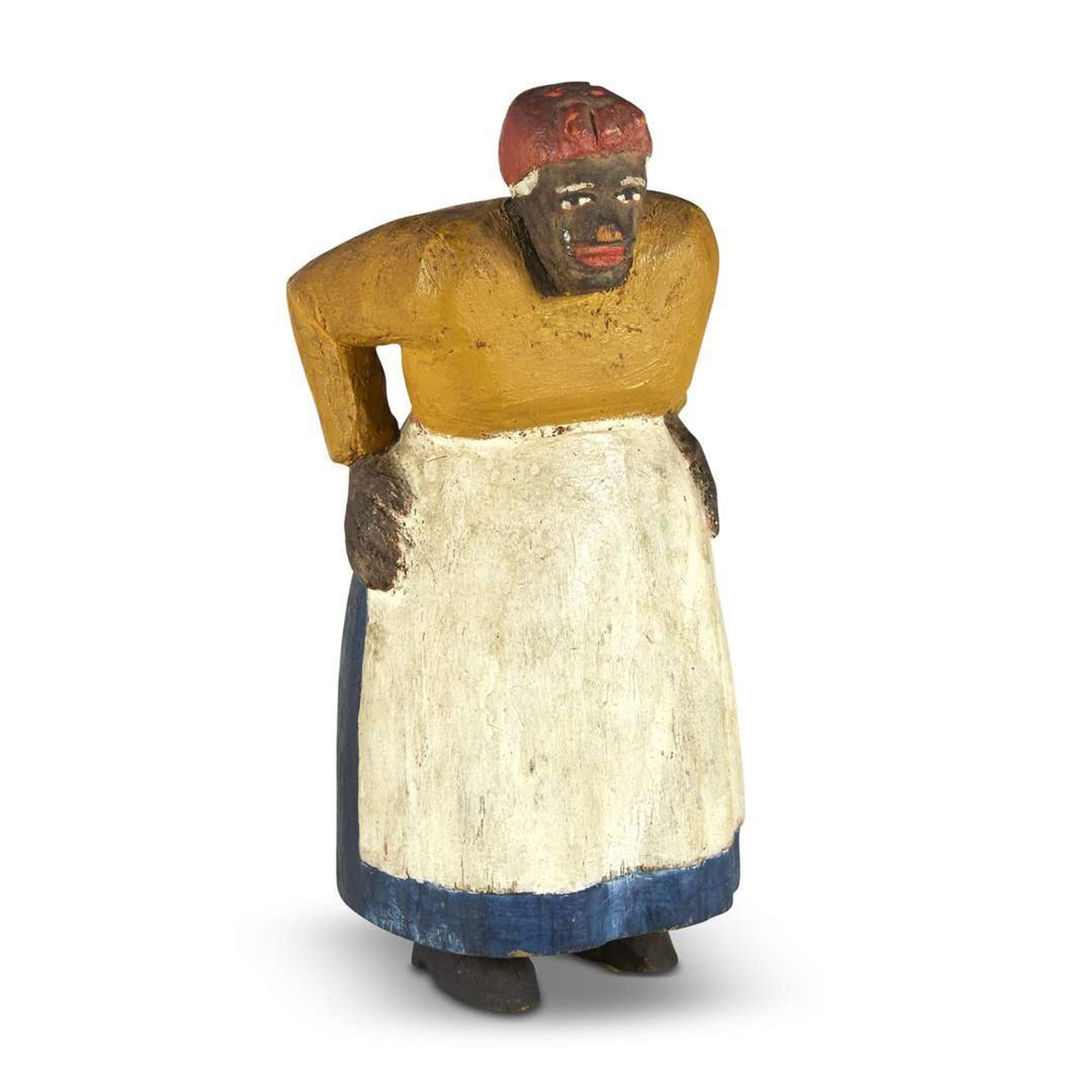 Carved and painted figure of an elderly woman 20th century