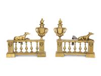 A Pair of French Brass Chenets with Recumbent Dogs