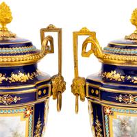 A Pair of Sèvres Style Porcelain, Enameled and Gilt Bronze Mounted Urns