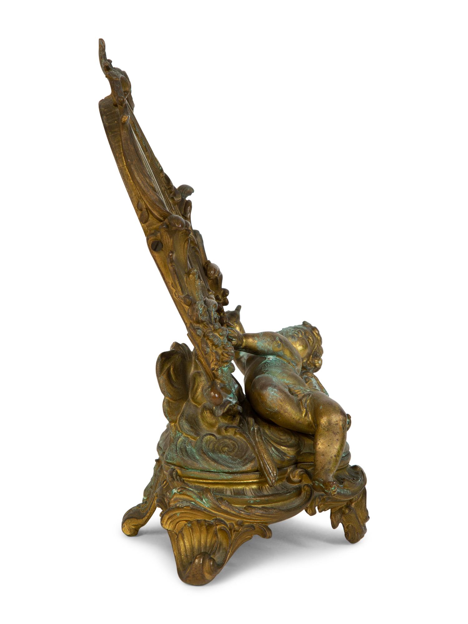 A Continental Rococo Style Gilt Metal Table Mirror