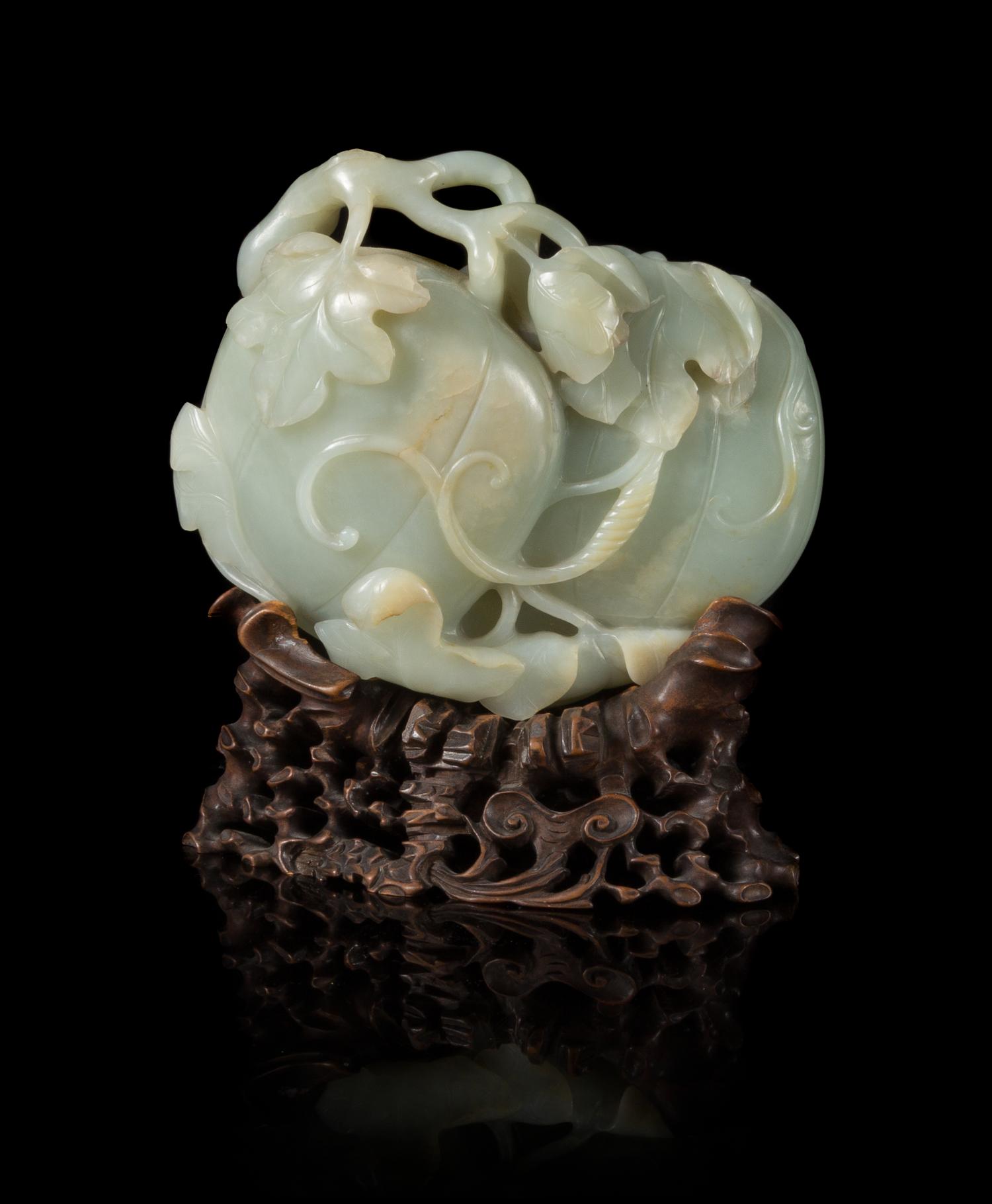 A Finely Carved Pale Celadon Jade Melon Group Width 6 inches. — 18TH CENTURY