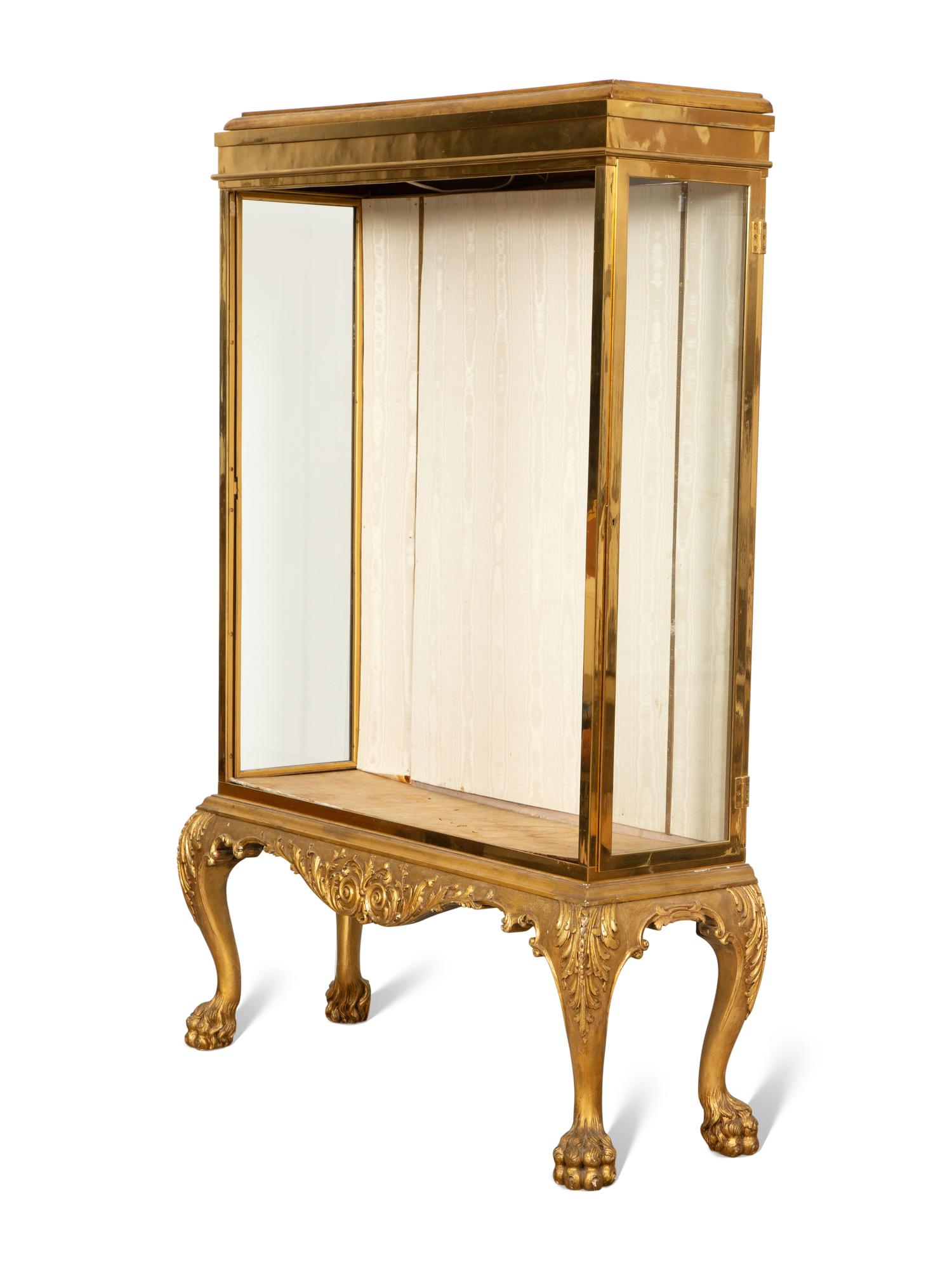 An English Brass Vitrine Cabinet on a Giltwood Base