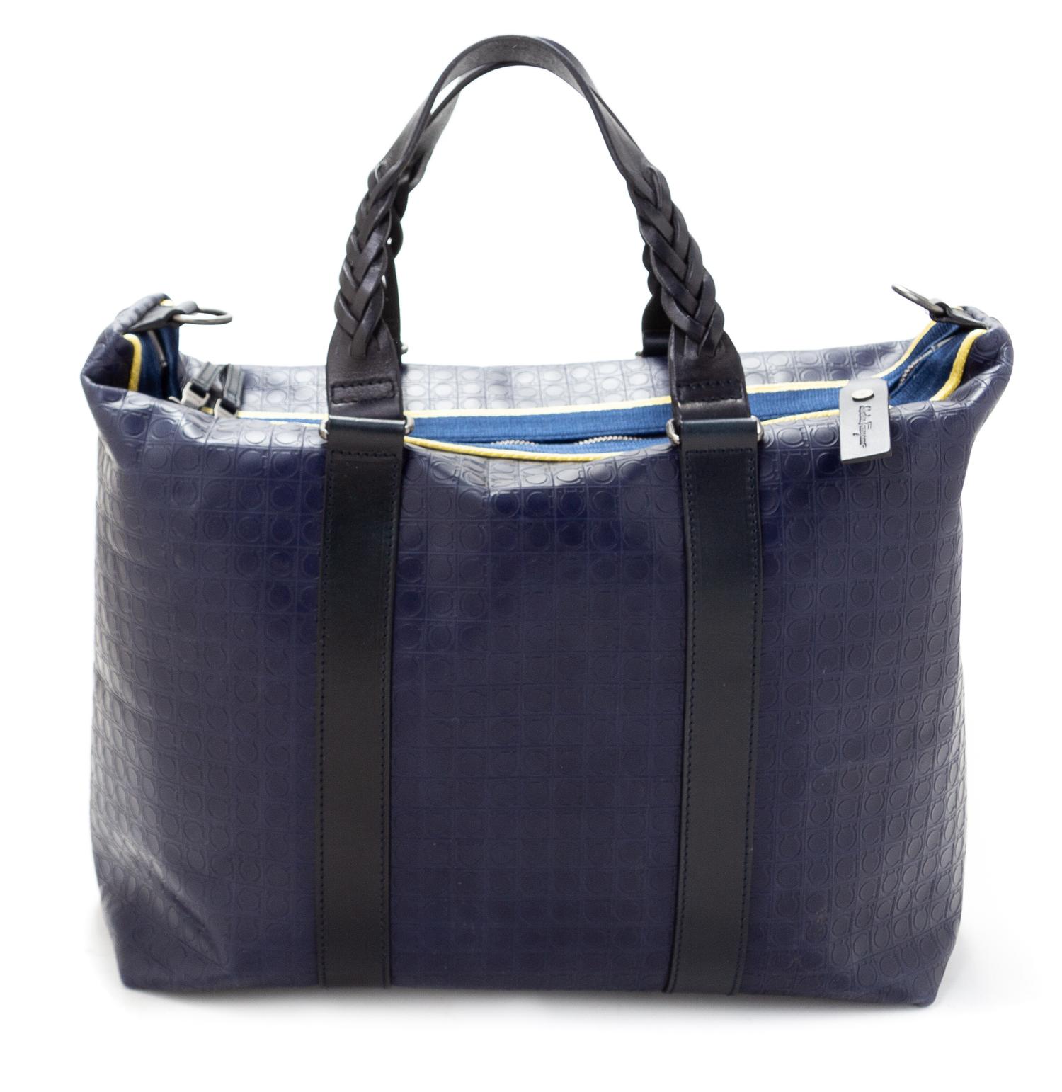 A Salvatore Ferragamo Navy Logo Embossed Leather Tote Bag, 11"H x 15"W x 7.25"D; Strap drop: 8".