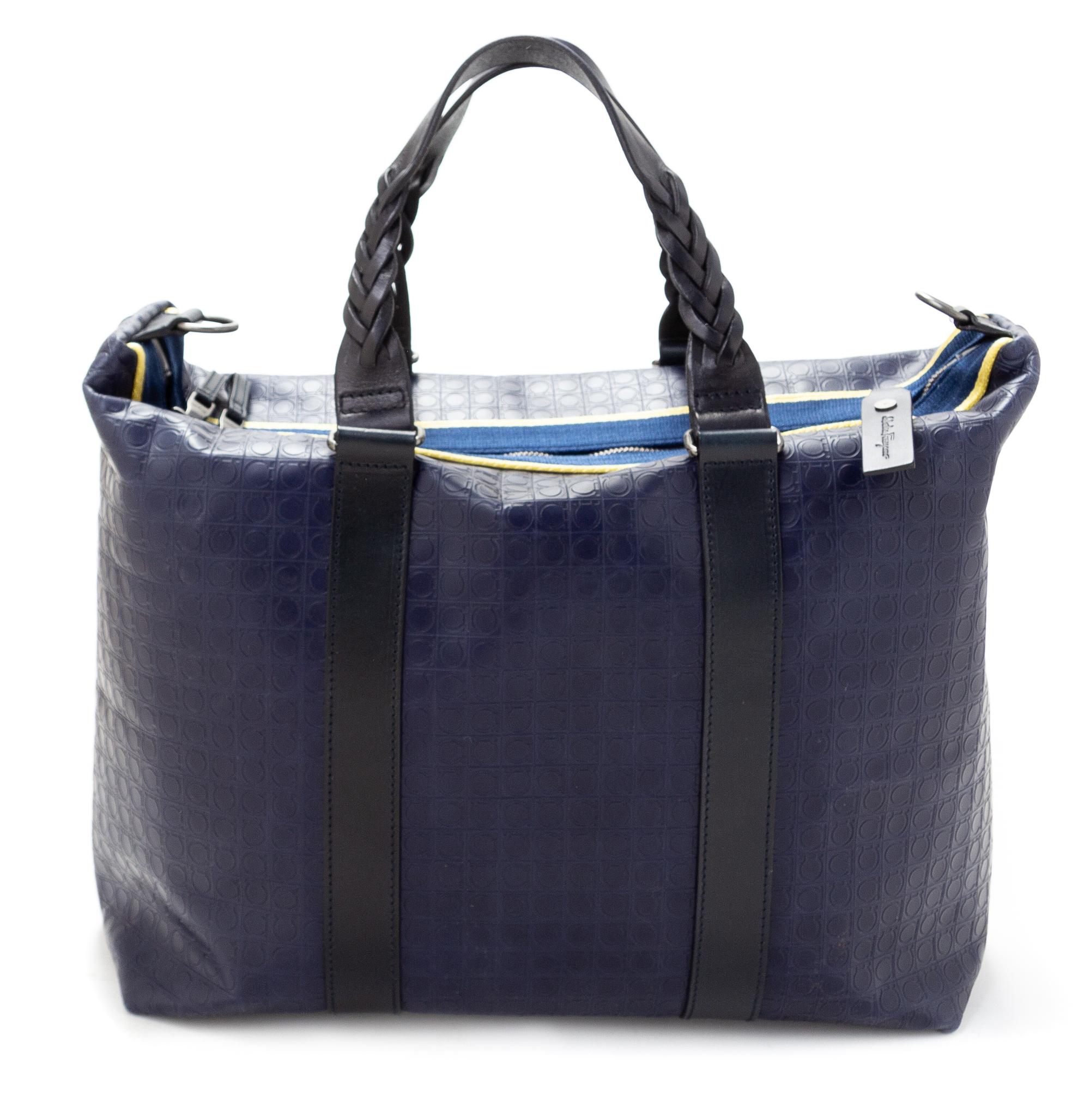 A Salvatore Ferragamo Navy Logo Embossed Leather Tote Bag, 11"H x 15"W x 7.25"D; Strap drop: 8".