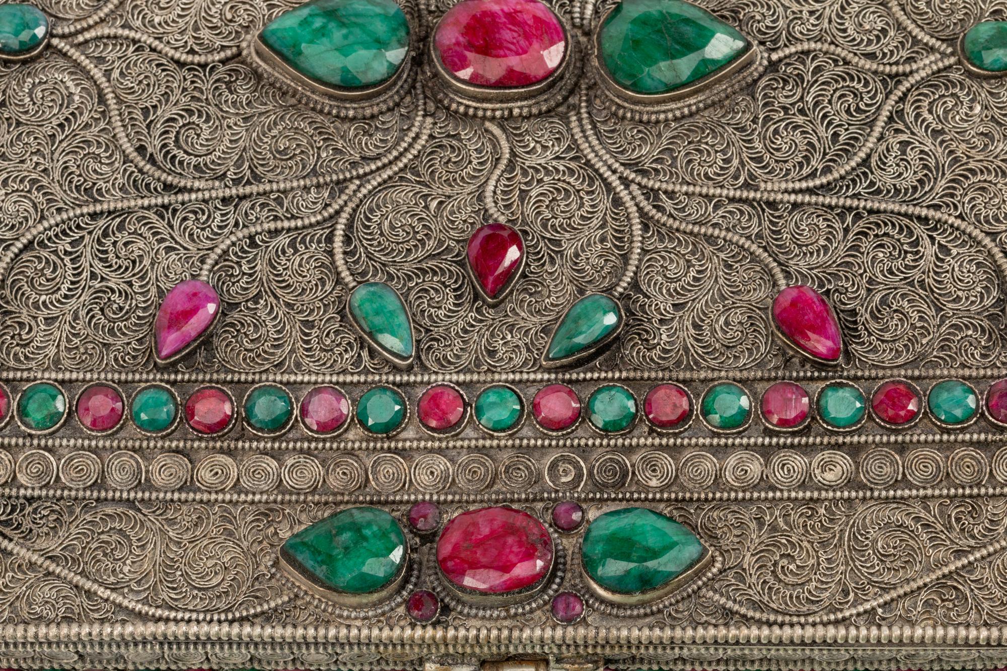A Ruby and Emerald-Encrusted Silvered Metal Filigree Casket