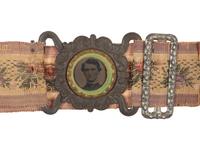 [CIVIL WAR]. Woman's woven belt with buckle containing gem-size tintype of a Civil War soldier.