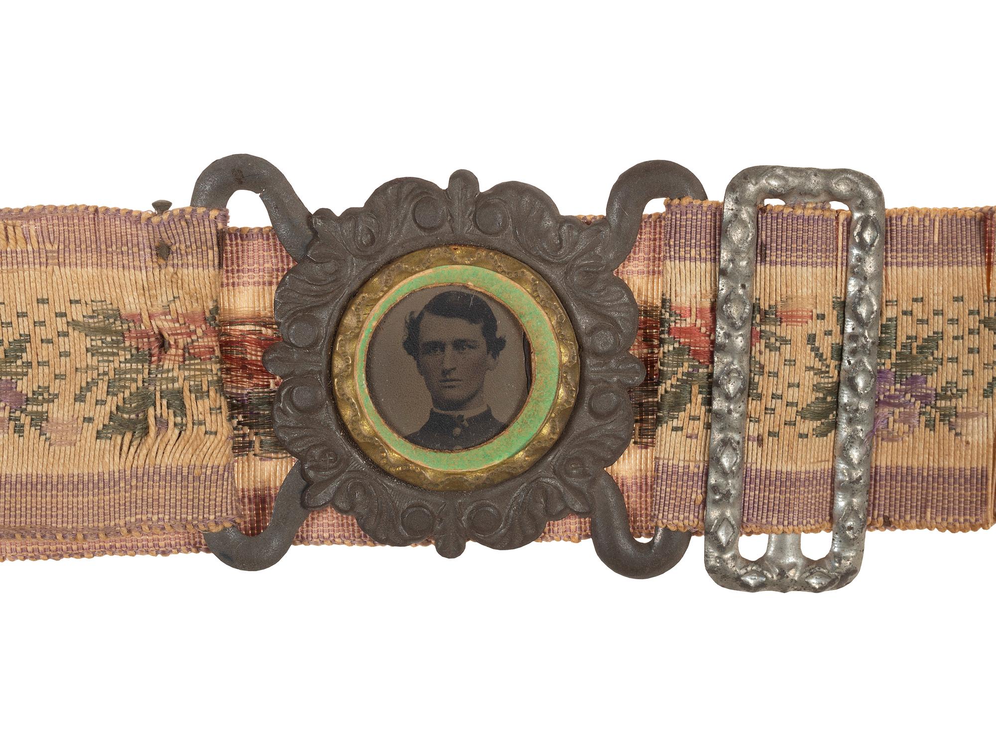 [CIVIL WAR]. Woman's woven belt with buckle containing gem-size tintype of a Civil War soldier.