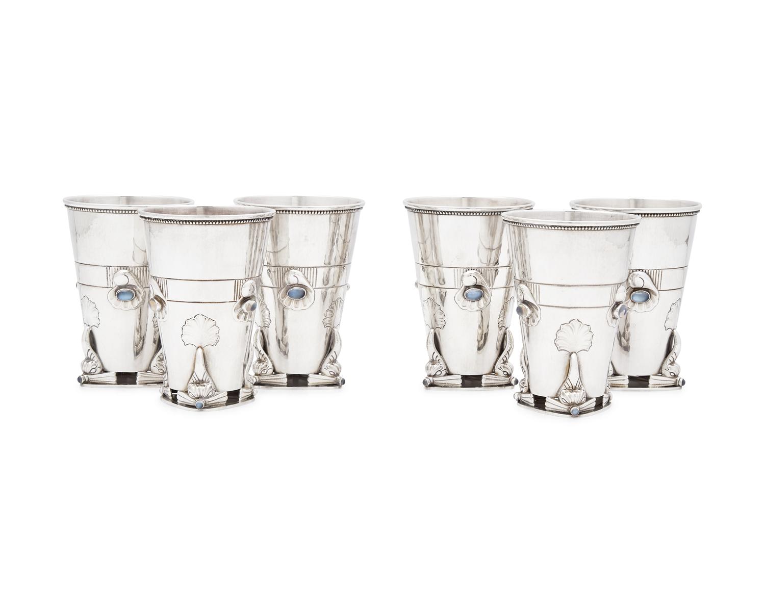 A Set of Six Georg Jensen Silver and Moonstone Mounted Beakers